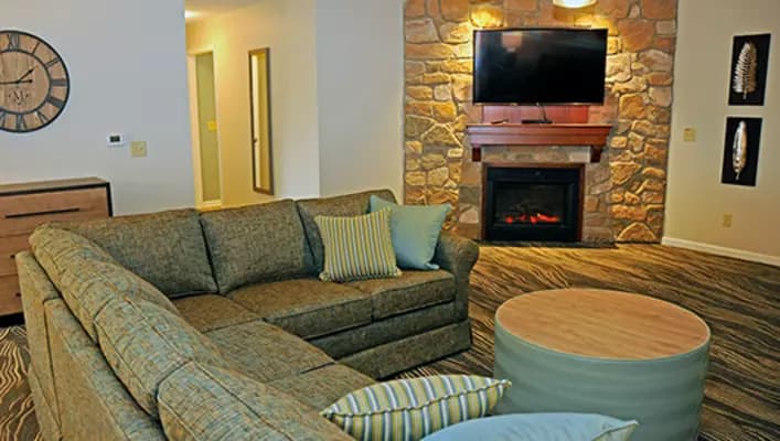Living room with sectional sofa and fireplace